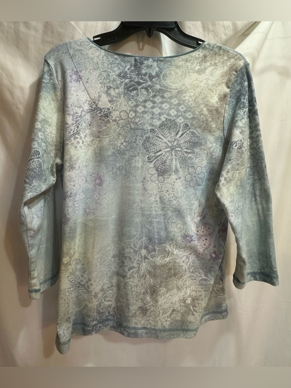 Light Blue Floral Scoop Neck Women's Top with a front flower with gem accents. - Picture 4 of 9